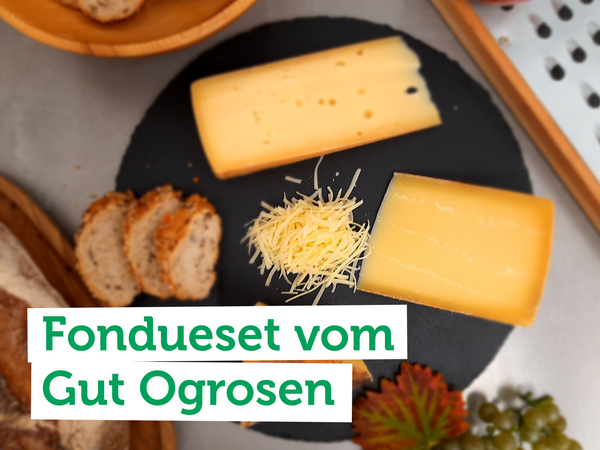 Menschen grillen und stoßen an. Text: "Alles für die Grillsaison".