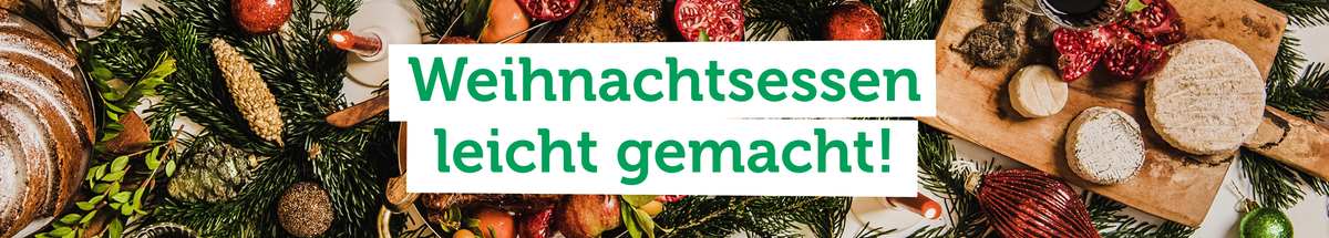 KI generiert: Weihnachtliche Speisen auf Tannenzweigen. Text: "Weihnachtsessen leicht gemacht!"